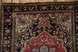 Antique Farahan Sarouk rug corner with intricate vinery, blossoms, and rewoven ivory border section.