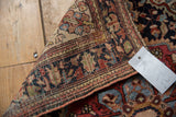 Intricate floral vinery, dense pile, and hand-knotted foundation of an antique Farahan Sarouk rug.