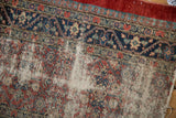 Classic pawn and palmette borders on an antique Serab rug with heavily worn, threadbare pile.