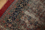 Corner detail of an antique Serab showing pawn and palmette borders with heavy wear to the foundation.