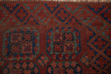 Detail of vintage Ersari rug: chestnut, navy, and muted teal blossom guls showing foundation.