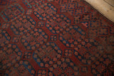 Vintage Ersari rug detail showcasing allover blossom guls in chestnut, navy blue, and blush with worn pile.