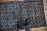 Sky blue Lilihan rug with raspberry red Veramin design and textured vintage pile.