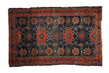 Antique Fine Senneh rug featuring a rare allover floral pattern in navy blue and rich red.