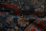 Antique Senneh rug's rare floral top views and vinery with weaver nuances in navy, red, beige.