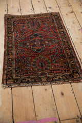 Vintage Lilihan rug: intact side cord selvage, brick red, navy floral Sarouk style details.