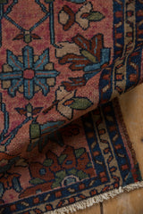 Hand knotted vintage Mehriban rug pile with dusty raspberry, blue floral vinery.