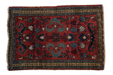 Vintage Borchalou rug mat with cherry red field, floral medallion, and blue cloudband motifs.
