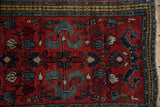 Vintage Borchalou rug's blossomed center floral medallion with pale blue cloudband motifs.
