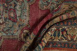 Antique Persian Doroksh rug detail: worn beige, rust, teal meandering vine and bud motif.