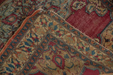 Antique Doroksh rug's detailed meandering vine border and cochineal red field alongside faded foundation.