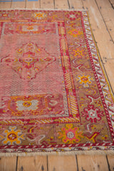 Vintage Anatolian rug's textured cherry red main border, with saffron and dusty gold floral designs.