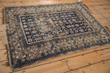 Corner detail of an antique Chichi Caucasian rug, featuring a serrated leaf main border.
