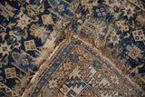 Corner of antique Caucasian rug revealing Chichi geometric starburst pattern and foundation.