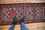 Vintage Borchalou runner's Herati design motif field with barber pole and meandering vine borders.