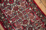 Vintage Borchalou rug's Herati design in deep blush, black cherry red, and oxidized silver hues.