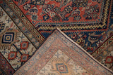 Hand knotted Malayer rug foundation and ivory fringe, with red-blue Herati pattern corner.