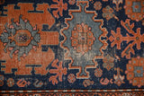 Vintage Hamadan rug with low pile texture, showing navy, terracotta, and platinum motifs.
