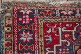 Vintage Karaja rug corner detail, showing original side cord selvages and worn fringe.