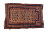 Antique Belouch rug featuring a geometric tree-of-life and wave border in camel, navy, and chestnut.