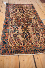 Hand knotted Persian Mohajeran Sarouk rug detail, ivory ground, terracotta, navy blossoms.