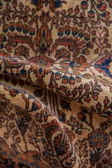 Vintage Mohajeran Sarouk rug pile texture with scrolling terracotta and navy floral bouquets.