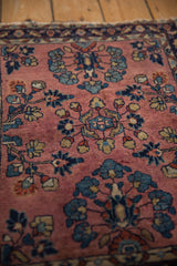 Vintage Persian Mohajeran Sarouk rug detail: dusty mauve field, expressive blue and ivory floral blossoms.