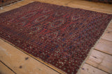 Vintage Turkmen rug detail: reciprocating gul medallions, hook-and-latch borders, mostly even wear.