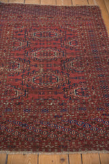 Intricate hook-and-latch borders and gul medallions on a vintage Turkmen rug.