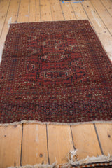 Black cherry red gul medallions and navy blue serpent borders on this vintage Turkmen rug.