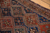 The newer wide selvage and textured knot heads of an antique Qashqai Persian rug's border.
