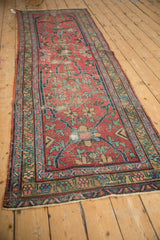 Vintage Heriz runner with geometric floral vinery in black cherry red, navy, and sky blue.