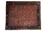 Vintage Persian Mahal carpet with dusty rose field and sprawling floral vines, navy border.