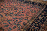 Vintage Mahal rug: navy blue border with scrolling serrated leaves, dusty rose field.
