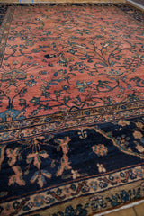 Vintage Mahal rug, dusty rose field with navy border's scrolling leaves and blossoms.