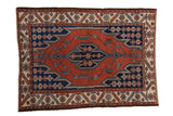 Vintage Hamadan square rug with brick red field, dark navy Maslaghan medallion, ivory geometric borders.