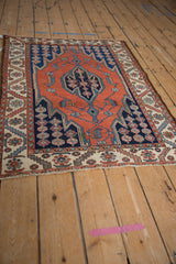 Maslaghan vintage Hamadan rug border with ivory, terracotta, and serrated navy motifs.