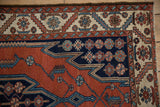 Vintage Hamadan Maslaghan rug corner with serrated lightning, navy and ivory borders.