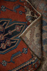 Detail of vintage Hamadan rug's serrated brick red pile and distinct hand-knotted foundation.