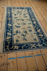 Peking runner's cobalt blue vine and blossom border with antique ivory field.