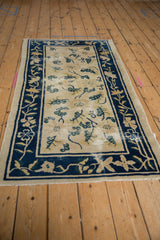 Cobalt blue continuous vine and blossom border on an antique ivory Peking runner.