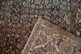 Vintage Malayer rug detail: sky blue and blush Herati pattern over hand-knotted backing.