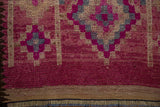 Evenly worn pile of a vintage Kurd runner with magenta knot heads, original selvage, and fringe.