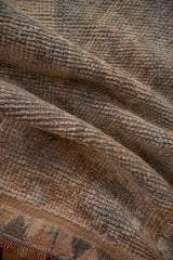 Distressed Kurd rug pile texture: worn knot heads, platinum silver, ivory, tangerine hues.