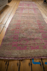Distressed Kurd runner texture, showing heavy abrashes, faded fuchsia and silver tones.