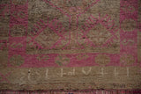 Distressed Kurd rug runner detail, with fuchsia geometric motifs and faint weaver insignia.
