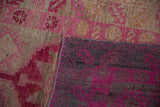 Hand-knotted foundation and distressed fuchsia geometric guls on a vintage Kurd runner.