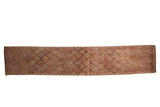 Distressed vintage Kurd runner rug, geometric blossom lattice pattern in muted coffee brown and dusty mauve.