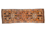 Distressed hand-knotted Kurd runner with geometric tangerine and navy blue vine motifs, 3'4