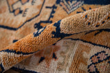 Distressed Kurd runner with short, uneven pile in tangerine, navy, ivory geometric.
